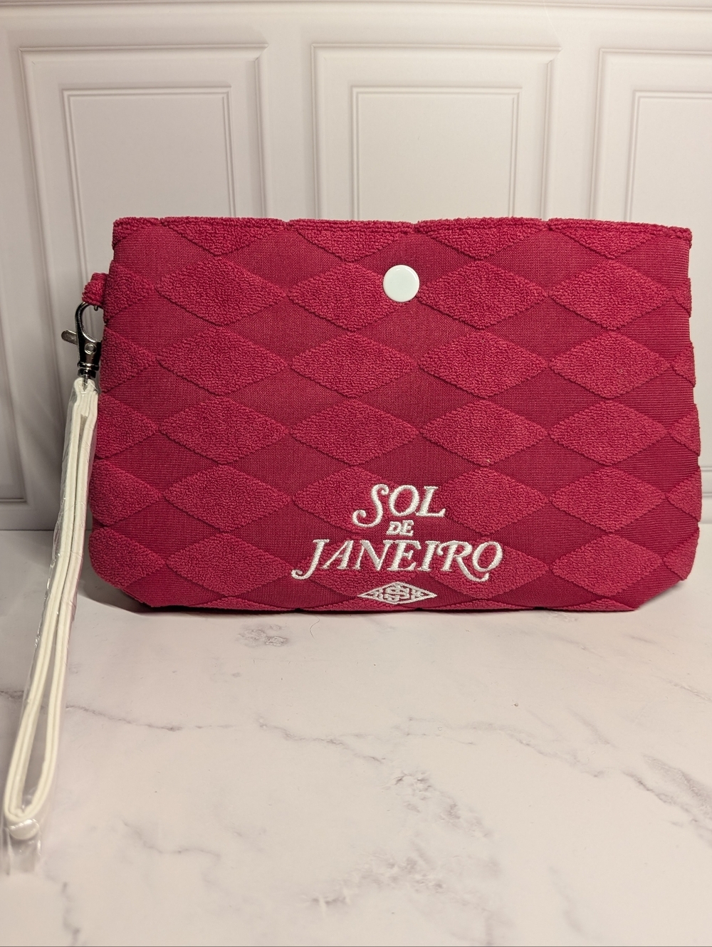 Sol de Janeiro Quilted Hot Pink Wristlet with White Strap